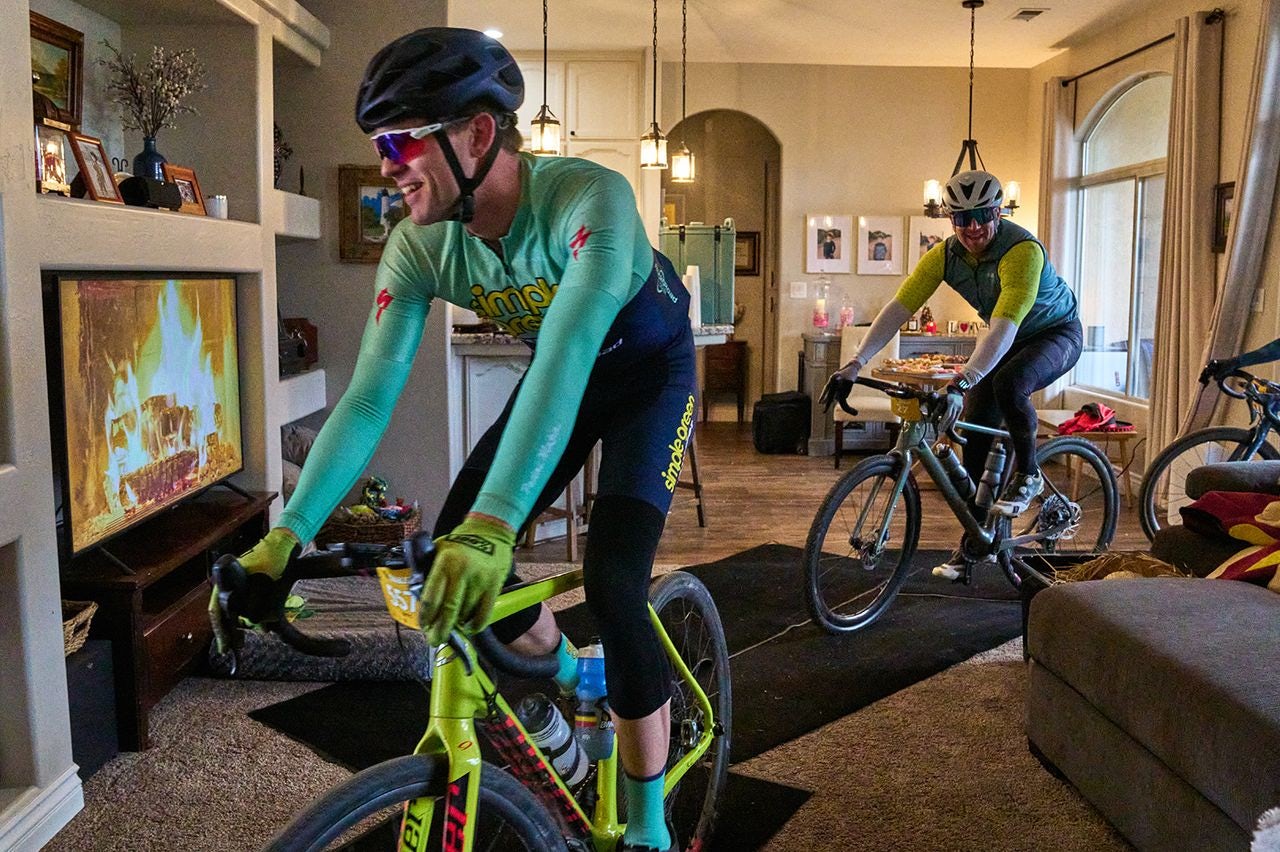 Gravel riders ride through a living room at the Rockcobble
